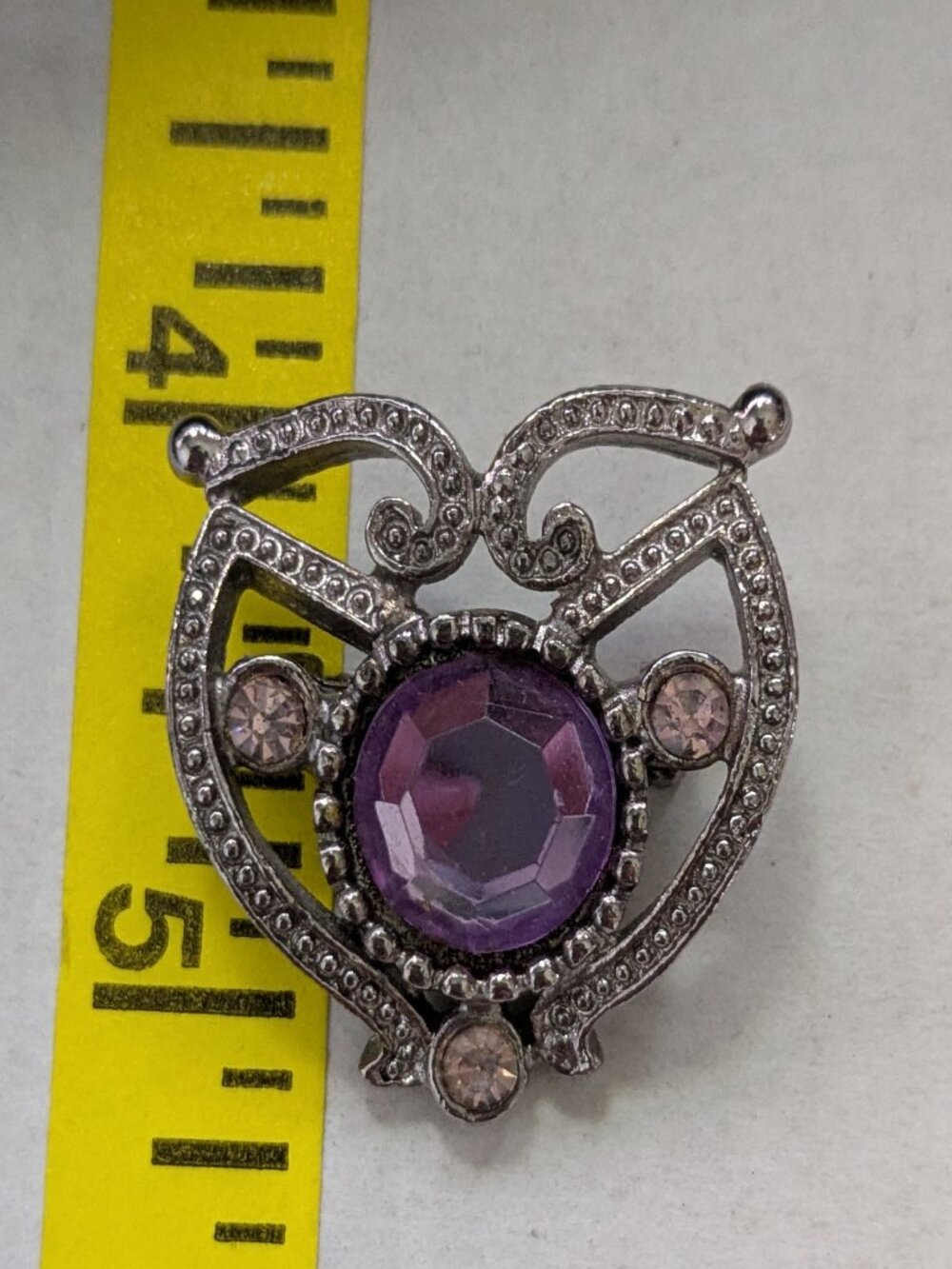 Small Silver Tone Purple Faceted Rhinestone Filigree Brooch Pin